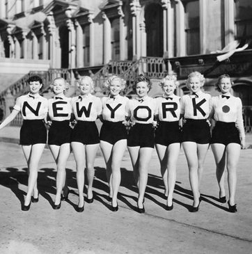 Photo of 50s women with letters on sweaters that spells New York